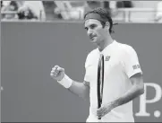  ?? KEVIN HAGEN / AP ?? Roger Federer celebrates beating Benoit Paire 7-5, 6-4, 6-4 in the second round of the US Open on Thursday.