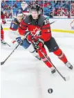  ?? MARK BLINCH, THE CANADIAN PRESS ?? Canada’s Sam Steel wheels past Slovakia’s Martin Bodak during action in Buffalo on Wednesday.