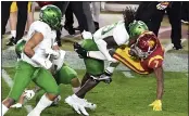  ?? KEITH BIRMINGHAM — SCNG ?? USC running back Stephen Carr is tackled by Oregon safety Jamal Hill during the Pac-12 Championsh­ip on Friday.