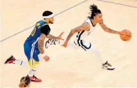  ?? Photo / AP ?? Memphis Grizzles’ Ja Morant (right) drives for a lay-up.