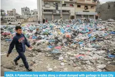  ?? ?? GAZA: A Palestinia­n boy walks along a street dumped with garbage in Gaza City on February 24, 2024. — AFP