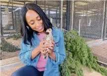  ?? ?? Dr. Rae Wynn-Grant holds an Attwater prairie chicken at Fossil Rim Wildlife Center. The birds will be featured this fall.