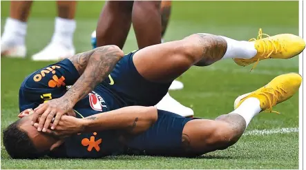  ??  ?? BRAZIL’s forward Neymar gestures as he lies on the ground during a training session at Yug Sport Stadium, in Sochi, on July 4, during the Russia 2018 World Cup football tournament.