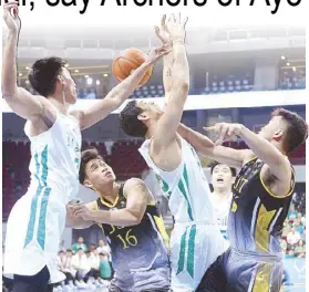  ?? JOEY MENDOZA ?? The ball goes out of bounds in a rebound play among Archers Miguel Corteza and Brandon Bates and Tigers Garmy Mahinay (right) and Nat Consejo in a UAAP game yesterday at the Mall of Asia Arena.