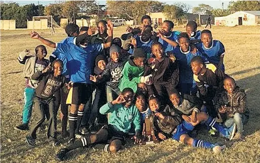  ??  ?? WINNER TAKES ALL: The members of Cosmos FC U15 side with some of their supporters following their win at the Nemato Youth Day Soccer Tournament, held in the township on Youth Day
