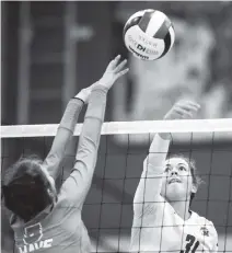  ?? DANIEL A. VARELA dvarela@miamiheral­d.com ?? Mater Academy junior setter Elaisa Villar (31) attempts to block a spike by Fort Myers senior opposite hitter Victoria Brown.