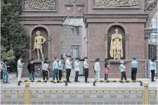  ?? KEVIN FRAYER GETTY IMAGES ?? People line up for COVID-19 tests on Monday in Beijing. The city will conduct mass testing of most of its 21 million people, officials say.