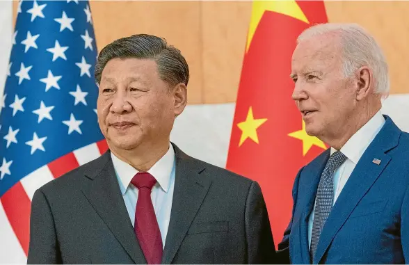  ?? AP ?? US President Joe Biden stands with Chinese President Xi Jinping before a meeting on the sidelines of the G20 summit meeting in Bali.