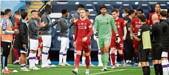  ?? — AP ?? An ex-Red rises: Manchester City’s Raheem Sterling celebratin­g after scoring the second goal against Liverpool at the Etihad. Inset: City players form a guard of honour for Liverpool.