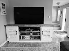  ??  ?? The finished credenza has 42-inch wide open shelving as well as large cabinets on either side.