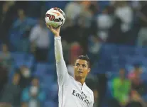  ?? ASSOCIATED PRESS FILE PHOTO ?? Real Madrid’s Cristiano Ronaldo celebrates his four goals during a match against and Elche in 2014 at the Santiago Bernabeu stadium in Madrid, Spain. Ronaldo announced he is leaving Real Madrid to join the Italian club Juventus.