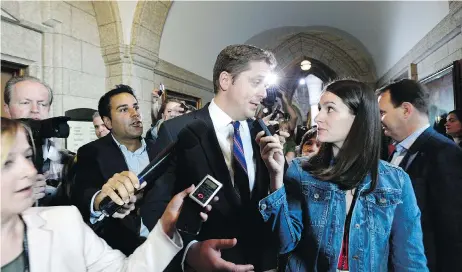  ?? JUSTIN TANG/THE CANADIAN PRESS ?? Conservati­ve leader Andrew Scheer leaves a caucus meeting on Parliament Hill Wednesday, after removing Maxime Bernier as a shadow minister.