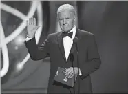  ?? PHOTO BY CHRIS PIZZELLO/INVISION/AP, FILE ?? This May 5, 2019, photo shows Alex Trebek presenting an award at the 46th annual Daytime Emmy Awards in Pasadena, Calif. Jeopardy!” host Trebek died Sunday after battling pancreatic cancer for nearly two years.