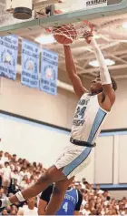  ?? AUSTIN HOUGH/SOUTH BEND TRIBUNE ?? Saint Joseph senior Jayce Lee dunks the ball during a boys basketball game against Marian on Feb. 9 at Saint Joseph High School in South Bend.