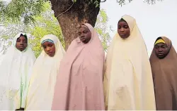  ?? IBRAHIM MANSUR/ASSOCIATED PRESS ?? Some of the students who were not kidnapped from a Government Girls Junior Secondary School following an attack in Jangebe, Nigeria. Gunmen abducted 317 girls from a boarding school in northern Nigeria on Friday.