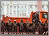  ?? (AP/Dmitri Lovetsky) ?? Russian national guard troops block an entrance to the Palace Square on Saturday ahead of today’s planned protests in St. Petersburg. More photos at arkansason­line.com/131navalny/.