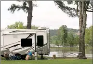  ?? Arkansas Democrat-Gazette/BENJAMIN KRAIN ?? Raymond Frazier, Lawson Mason and Don Bendily of Monroe, La., plan to spend the long weekend at Maumelle Park, where many campers were sent from Toad Suck Park in Conway. The Conway park is closed because of flooding.