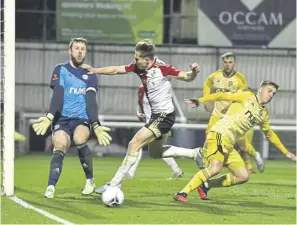  ?? ?? Town’s resolute defence proved too strong for Woking.