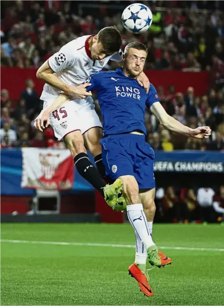  ??  ?? Picking up the pieces: Leicester’s Jamie Vardy in action with Sevilla’s Clement Lenglet in the Champions League last 16 first-leg match on Wednesday. Sevilla won 2-1. — Reuters