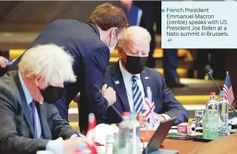  ?? AP ?? French President Emmanuel Macron (centre) speaks with US President Joe Biden at a Nato summit in Brussels.