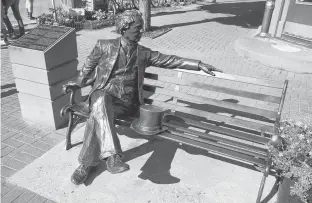  ?? 123RF STOCK ?? A statue of Canada's first prime minister, John A. Macdonald, sits at the entrance to the part of Richmond Street known as Victoria Row.