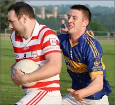  ??  ?? Ferns St. Aidan’s captain Colm Whelan is challenged by Seán Finan.