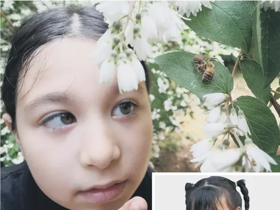  ?? ?? A youngster (above) enjoys minibeast hunting in the garden
A girl (right) makes clothing from recyclable material (photos: Adobe)