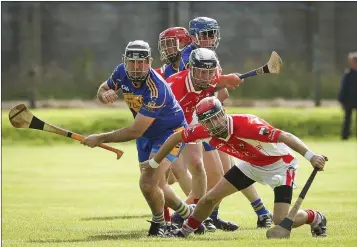  ??  ?? Carnew’s Graham Keogh and Glenealy’s Enan Glynn battle for the ball during the SHC in Aughrim.