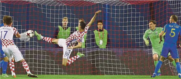  ??  ?? Croatia’s Nikola Kalinic attempts to score against Ukraine in their World Cup qualifier on Friday.