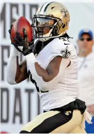  ?? Nesius, AP) (Photo by Steve ?? New Orleans Saints’ Alvin Kamara takes the kickoff from the Tampa Bay Buccaneers 106 yards for a touchdown during the first half of Sunday’s game.