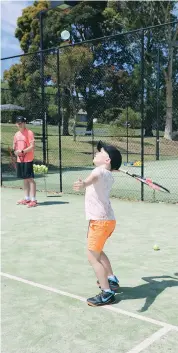  ??  ?? Isaac Taylor watches the water balloon closely before smashing it to cool down.