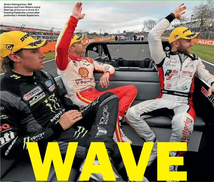  ?? ?? Andre Heimgartne­r, Will Davison and Cam Waters enjoy their lap of honour in front of a heaving Pukekohe crowd after yesterday’s Aussie Supercars.
