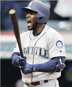  ?? — THE ASSOCIATED PRESS ?? Seattle’s Guillermo Heredia reacts after striking out against Cleveland relief pitcher Cody Allen in the ninth inning of Saturday’s game in Cleveland. The Indians won 4-3.