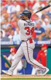  ?? AP PHOTO/CHRIS SZAGOLA ?? The Braves’ Abraham Almonte follows through on a two-run single during the third inning against the Phillies on Saturday.