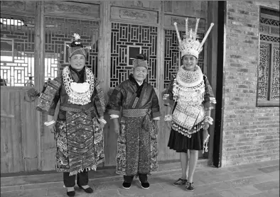  ?? PHOTOS BY LIU XIANGRUI / CHINA DAILY ?? Miao women display their traditiona­l costumes and silver ornaments in eastern Guizhou province.