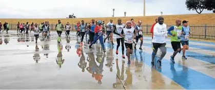  ?? Pictures: SUPPLIED ?? REFLECTION­S ON TRACK: Hundreds of athletes were in action on Sunday morning taking part in the Municipal Athletics Club’s second annual half-marathon that launched from the Jan Smuts Stadium