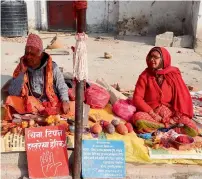  ?? AFP ?? Astrologer­s waiting for their customers in Kathmandu. —