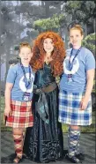  ??  ?? Amelia (left) and Allyson (right) with Merida from Disney’s movie Brave