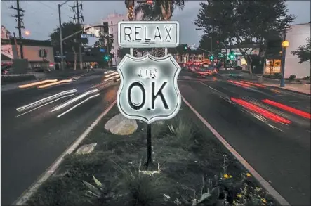  ?? Robert Gauthier Los Angeles Times ?? A MEDIAN SIGN on Santa Monica Boulevard offers words of encouragem­ent Wednesday to passersby in West Hollywood.