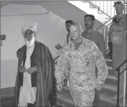  ??  ?? APOLOGY: The Commander of US and NATO troops in Afghanista­n, US Marine Lt. General John Allen, center right, walks Friday with Governor of Logar Province, Allhaj Mohammad Tahir Sabari, south of Kabul, Afghanista­n. Allen apologized Friday for civilian...