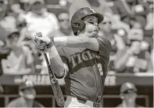  ?? Nati Harnik / Associated Press ?? LSU catcher Michael Papierski, the Astros’ ninth-round draft pick, delivers the first of his two home runs against Oregon State on Saturday in Omaha, Neb.