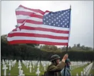  ?? THIBAULT CAMUS—ASSOCIATED PRESS ?? Men in WWImilitar­y uniforms pose in the Meuse-Argonne cemetery, northeaste­rn France, during a remembranc­e ceremony, Sunday, Sept. 23, 2018.