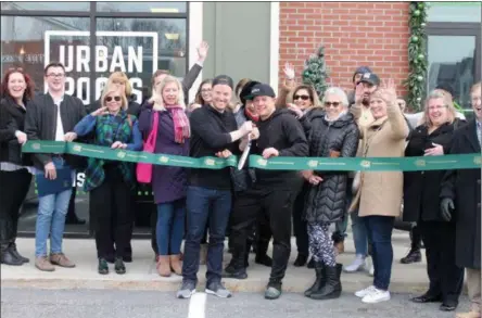  ?? PHOTOS BY LAUREN HALLIGAN — DIGITAL FIRST MEDIA ?? Co-owners Allen Caruso and Brandon Acres, center, cut the ribbon during a grand opening ceremony for Urban Roots, a new juice, smoothie and avocado bar in Saratoga Springs.