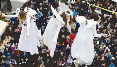  ?? REUTERS ?? Caption Caption Caption Caption Caption Caption Caption Caption Caption Caption Caption Caption Caption Caption Caption Caption Caption Caption Caption Caption Caption Caption Caption Women dressed as angels wave to spectators as they hang from a wire during a Christmas market in the town of Ustek, Czech Republic yesterday.