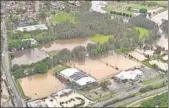  ?? AP ?? ■
An aerial view of flooded fields in Gold Coast. Rain lashed parts of Australia on Saturday as bushfires raged in others.
