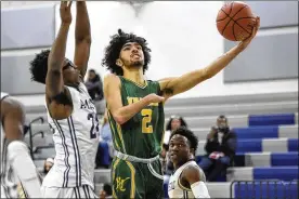  ?? MARK MIRKO / HARTFORD COURANT ?? New London, Conn., senior center Syncere Gray (2), is one of the Whalers’ top scorers, so quick and smooth with the ball that many seeing him for the first time do not even realize at first that he is playing with one hand.