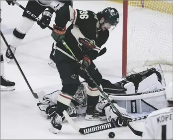  ?? AP PHOTO/STACY BENGS ?? Los Angeles Kings goaltender Cal Petersen (40) blocks the net from Minnesota Wild right wing Mats Zuccarello (36) during the first period of an NHL hockey game on Sunday in St. Paul, Minn.