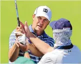  ?? CURTIS COMPTON/ATLANTA JOURNAL CONSTITUTI­ON VIA AP ?? A day after winning the Valero Texas Open, Jordan Spieth, left, works with his swing doctor Cameron McCormick in getting in some work for the Masters on the practice range at Augusta National.