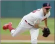  ?? TONY DEJAK — THE ASSOCIATED PRESS ?? The Indians are hoping Trevor Bauer, shown pitching to the Red Sox on Aug. 24, is rejoined by injured teammates in time for the playoffs.