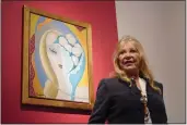  ?? ALBERTO PEZZALI — THE ASSOCIATED PRESS ?? Pattie Boyd poses next to the artwork by E. Frandsen De Schomberg, used for the cover of Derek and the Dominoes album “Layla and Other Assorted Love Songs.”